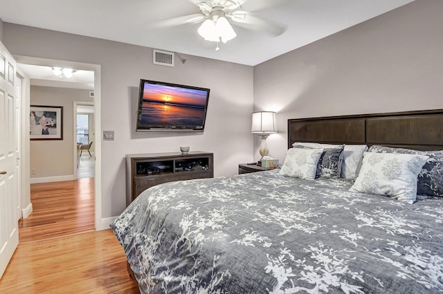 bedroom featuring hardwood / wood-style floors and ceiling fan