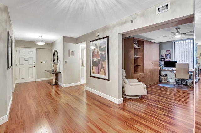 hallway with wood-type flooring