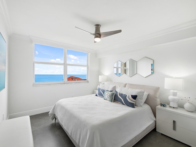 bedroom with ceiling fan, crown molding, and a water view