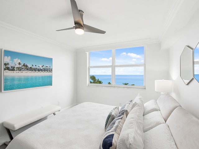 bedroom featuring ceiling fan, a water view, and ornamental molding