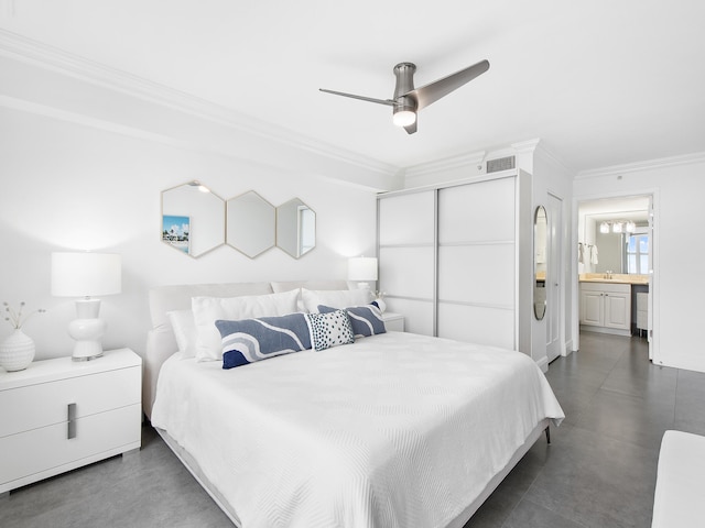 bedroom featuring connected bathroom, ceiling fan, crown molding, and sink