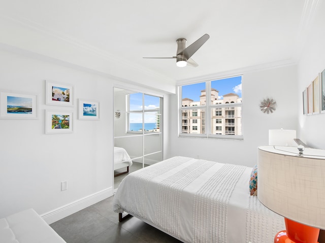 bedroom featuring ceiling fan and crown molding