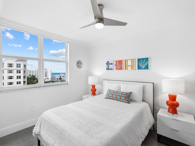 bedroom with ceiling fan and crown molding