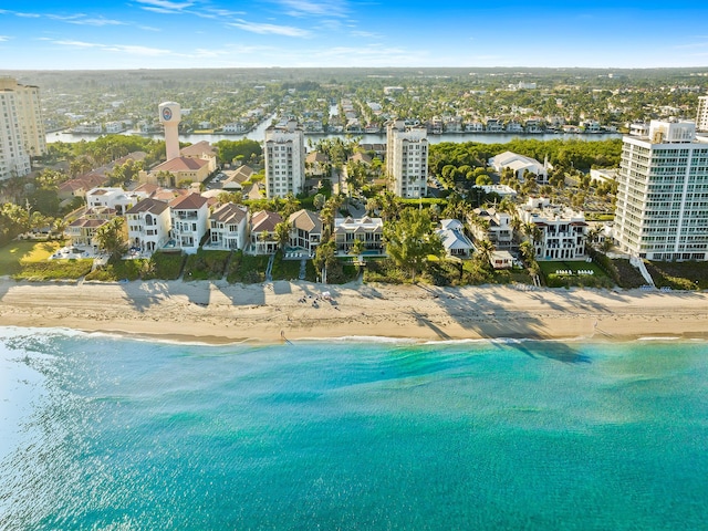 birds eye view of property featuring a water view and a view of the beach