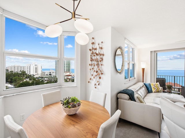 dining room featuring a water view