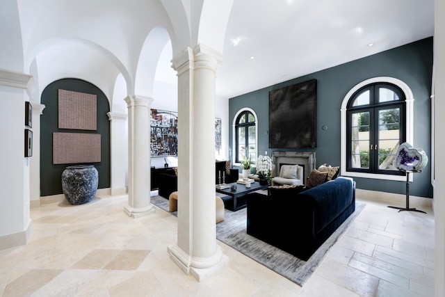 living room with french doors and ornate columns