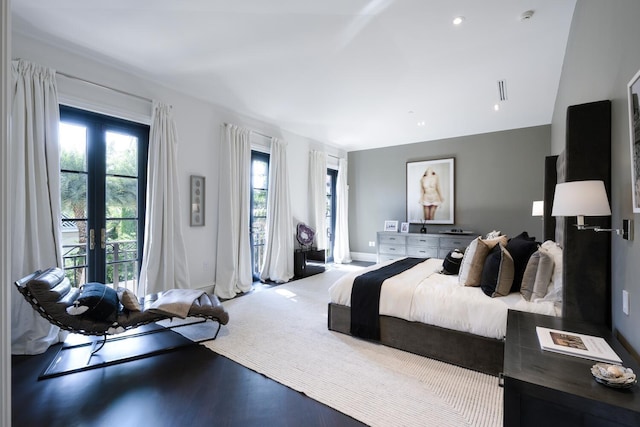 bedroom featuring french doors and wood-type flooring