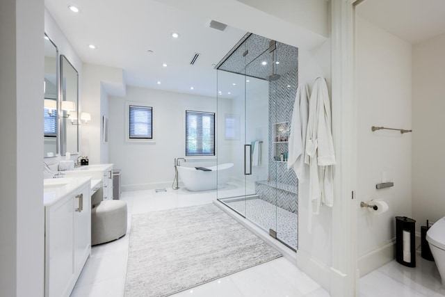 full bathroom with vanity, shower with separate bathtub, toilet, and tile patterned floors