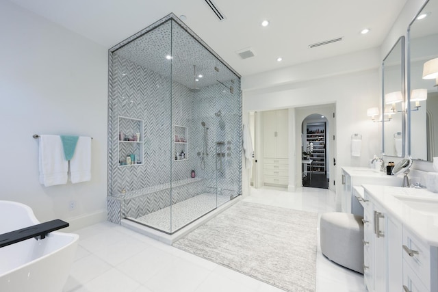 bathroom with vanity, plus walk in shower, and tile patterned floors