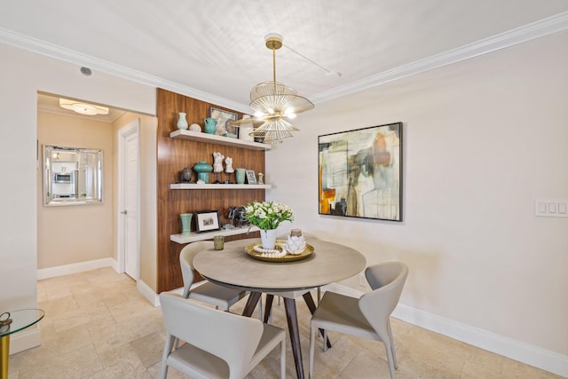 dining room featuring crown molding and a notable chandelier