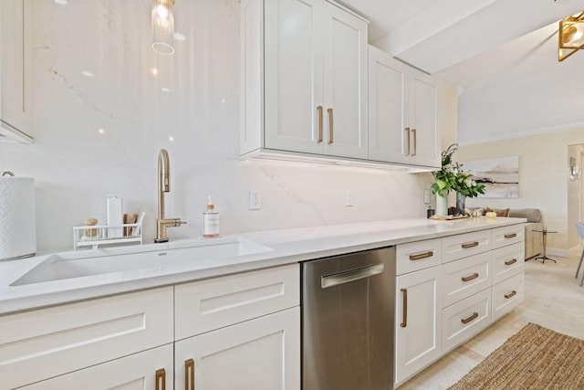 kitchen featuring white cabinets, light stone countertops, ornamental molding, dishwasher, and sink