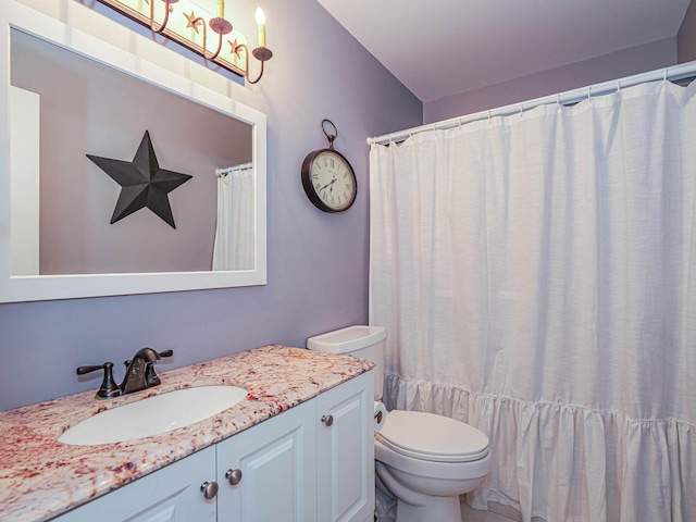 bathroom with toilet and vanity