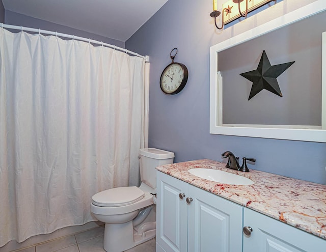 full bathroom featuring vanity, toilet, and tile patterned floors