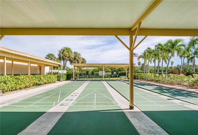 view of home's community featuring shuffleboard