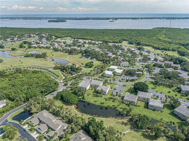 birds eye view of property featuring a water view and a residential view