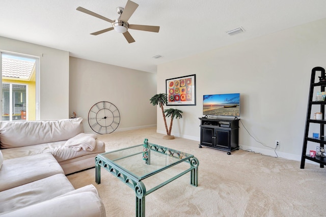 living room with light carpet and ceiling fan