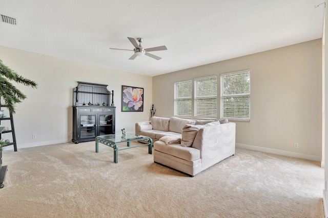 living room featuring light carpet and ceiling fan