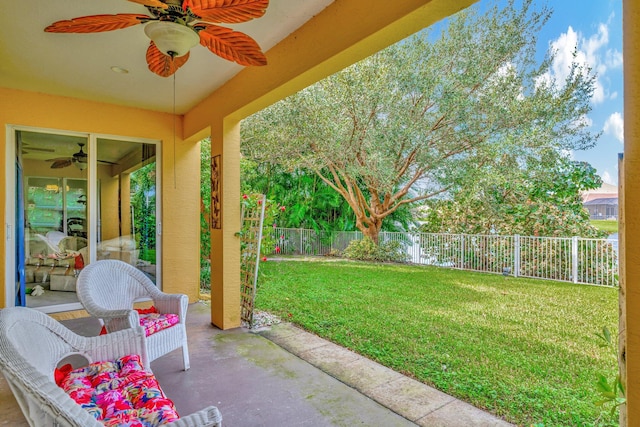 view of yard featuring a patio and ceiling fan