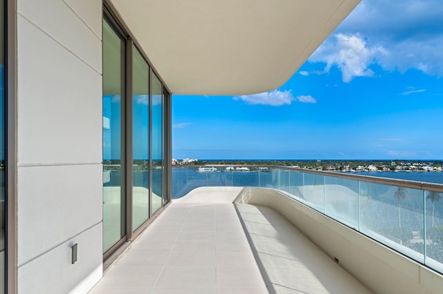 balcony featuring a water view