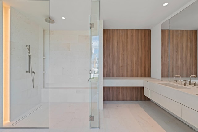 bathroom featuring vanity and an enclosed shower