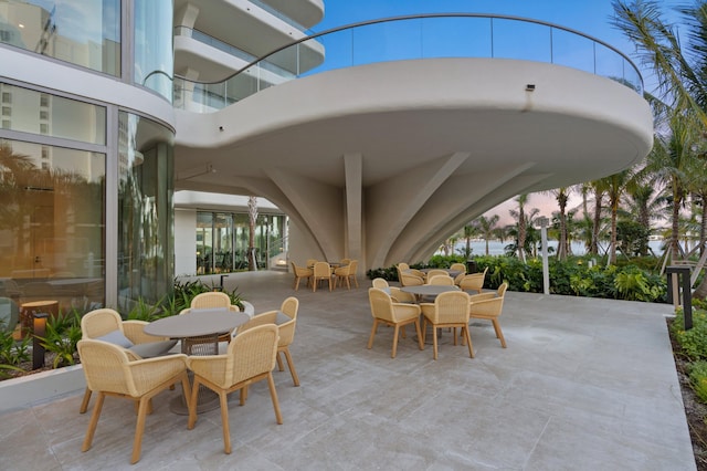 view of patio terrace at dusk