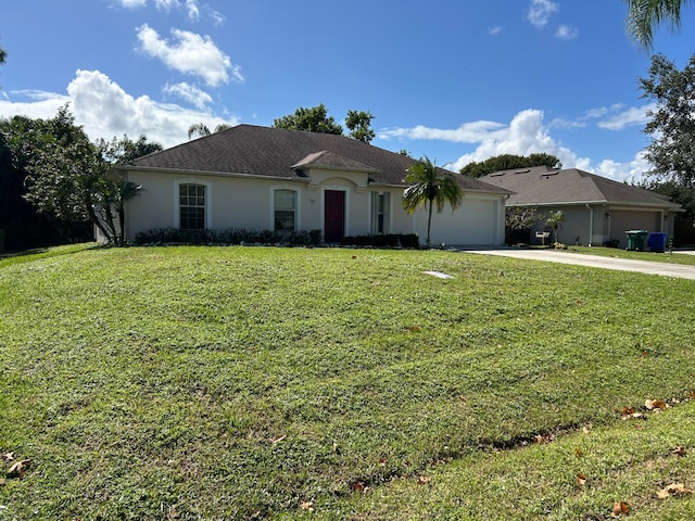 ranch-style home with a front yard and a garage