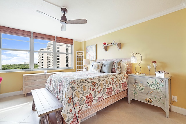 bedroom featuring tile patterned flooring, baseboards, ceiling fan, and crown molding