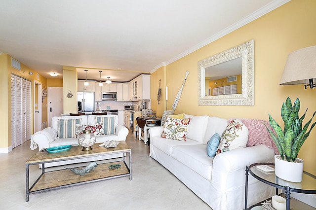 living area featuring visible vents and crown molding