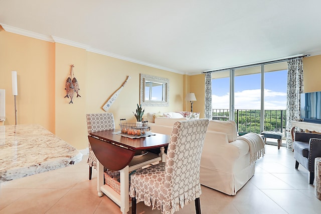 dining room with expansive windows, light tile patterned flooring, and crown molding