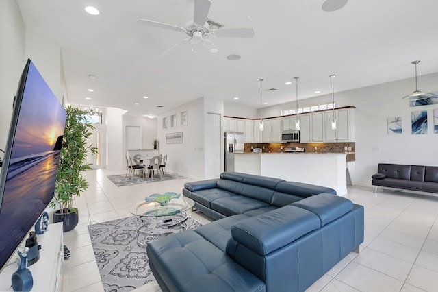 tiled living room with ceiling fan