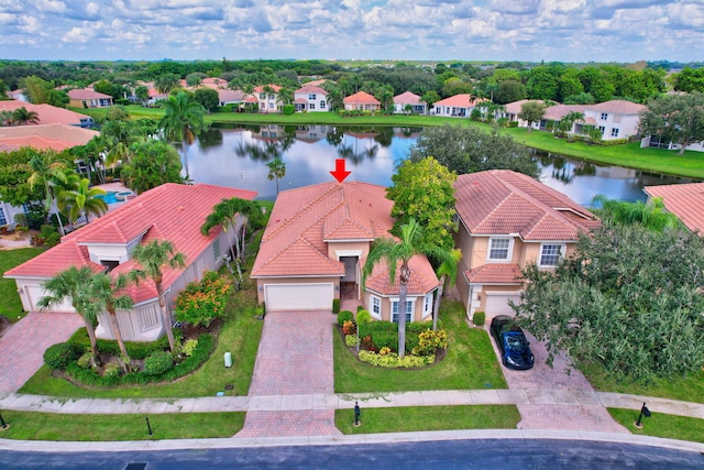 birds eye view of property featuring a water view