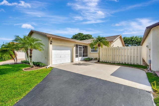 ranch-style house with a garage and a front lawn