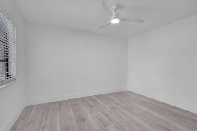 empty room featuring light wood-type flooring and ceiling fan