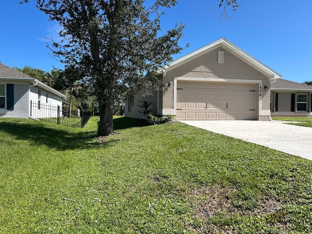 view of front facade with a front yard and a garage