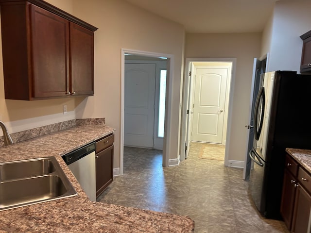 kitchen featuring sink, dark brown cabinets, and stainless steel appliances