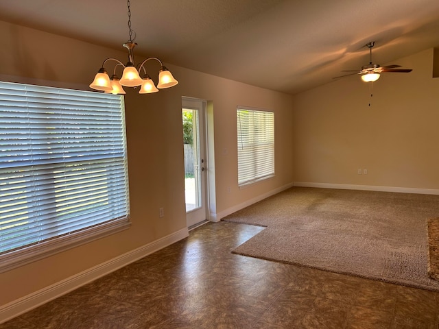 interior space with lofted ceiling and ceiling fan with notable chandelier