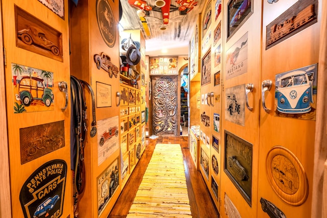 corridor featuring dark hardwood / wood-style floors