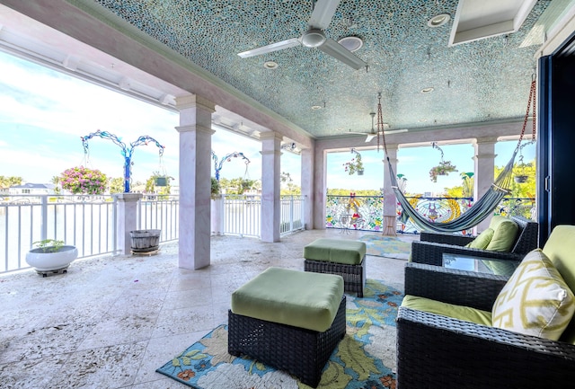 view of patio featuring ceiling fan