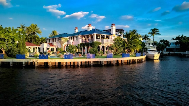 back of house featuring a water view