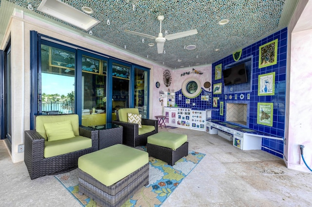 view of patio / terrace with ceiling fan and outdoor lounge area