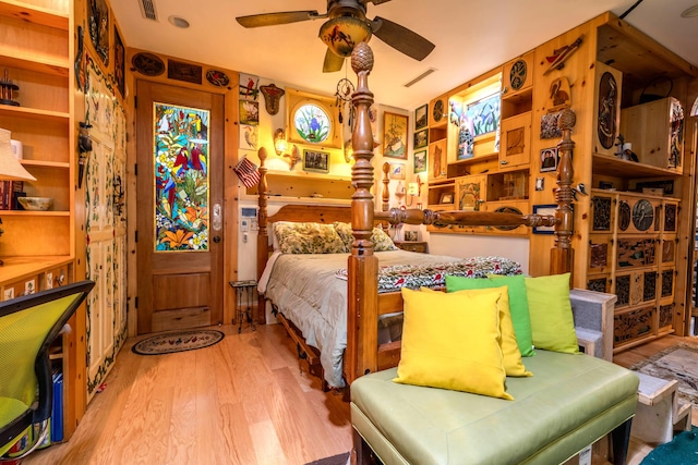 bedroom featuring light wood-type flooring and ceiling fan