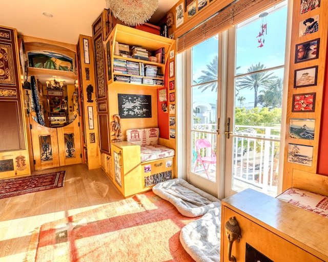 interior space with light wood-type flooring and french doors