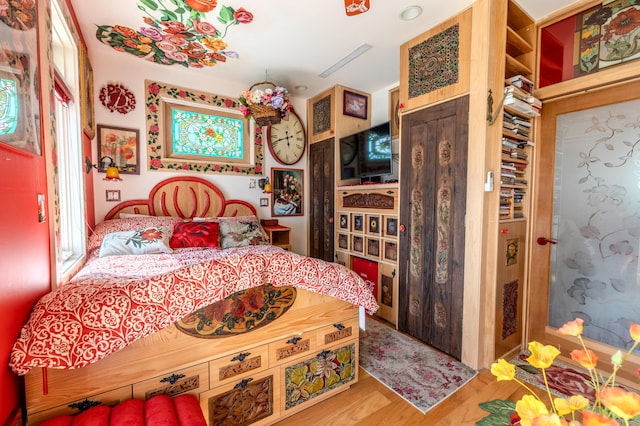 bedroom with wood-type flooring