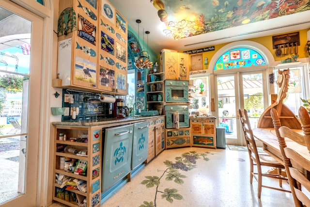 kitchen featuring plenty of natural light, double oven, and tasteful backsplash