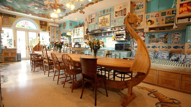 dining area featuring bar area