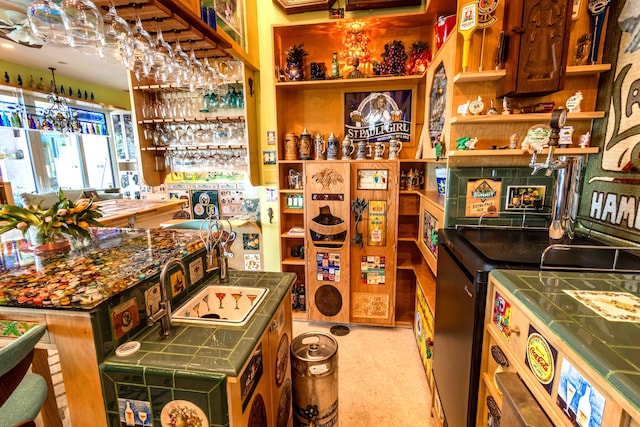 kitchen featuring tile counters and carpet flooring