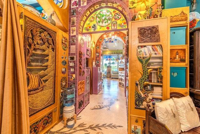 hallway featuring vaulted ceiling