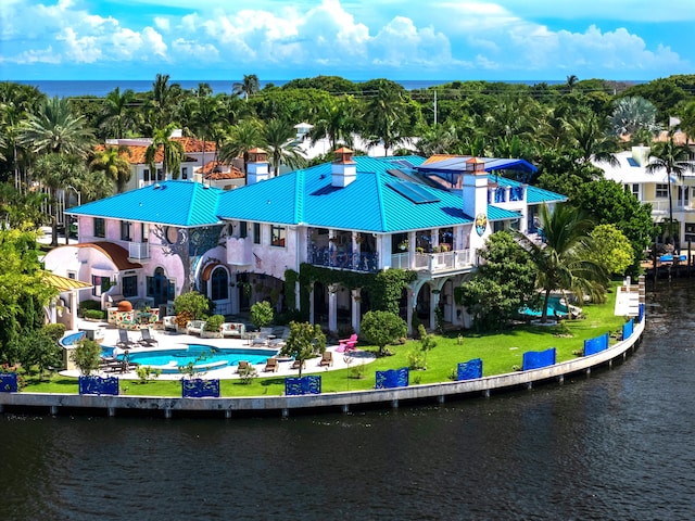 birds eye view of property with a water view