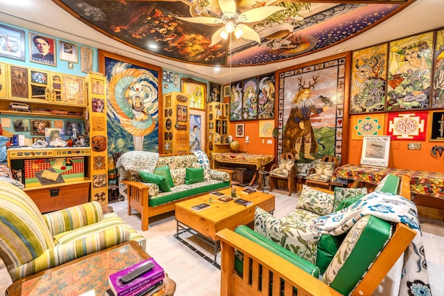 sitting room featuring light hardwood / wood-style floors and ceiling fan