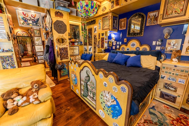 bedroom with dark wood-type flooring